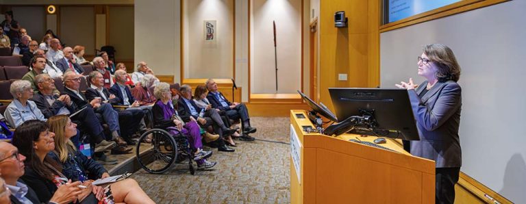 At the symposium, Dana-Farber BMT leader Dr. Leslie Kean praised Storb's scientific contributions and mentorship legacy.